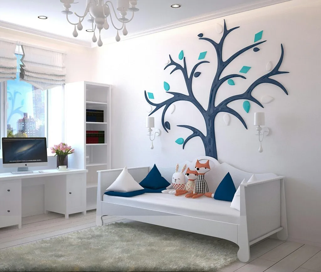 pexels-photo-1648768-1648768 A stylish children's room with a modern design featuring a tree wall art and plush toys.